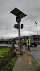 Traffic signal controller being installed